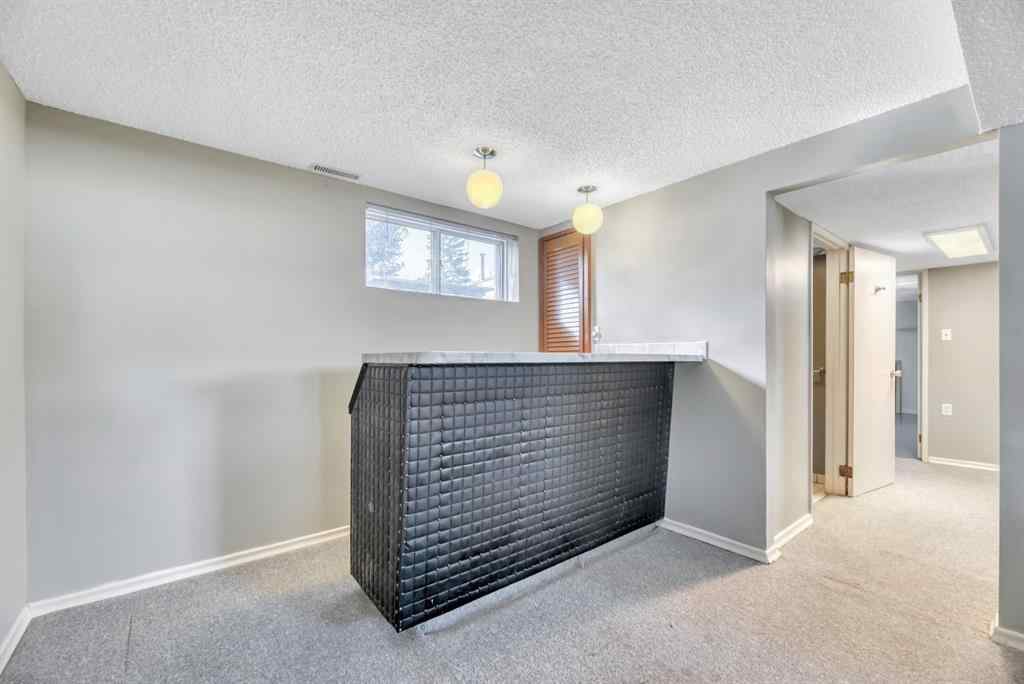 MLS® A2260198 - 23 Brazeau Crescent SW in Braeside Calgary, Residential