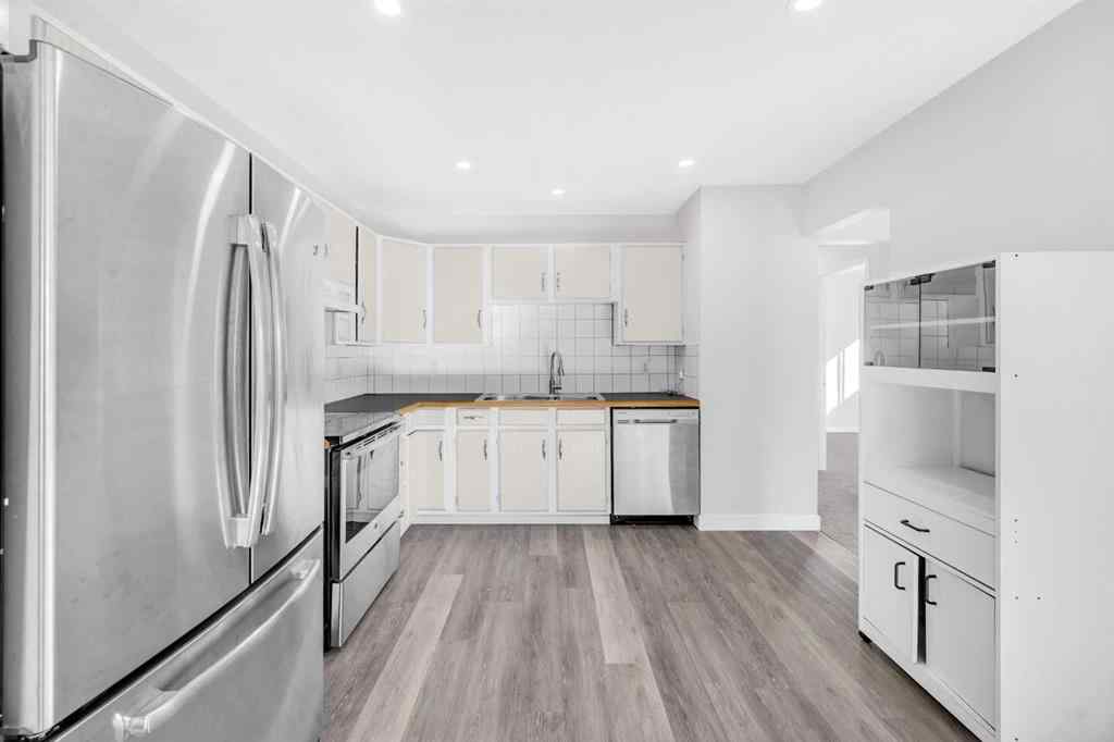 MLS® A2260226 - 325 Woodvale Crescent SW in Woodlands Calgary, Residential