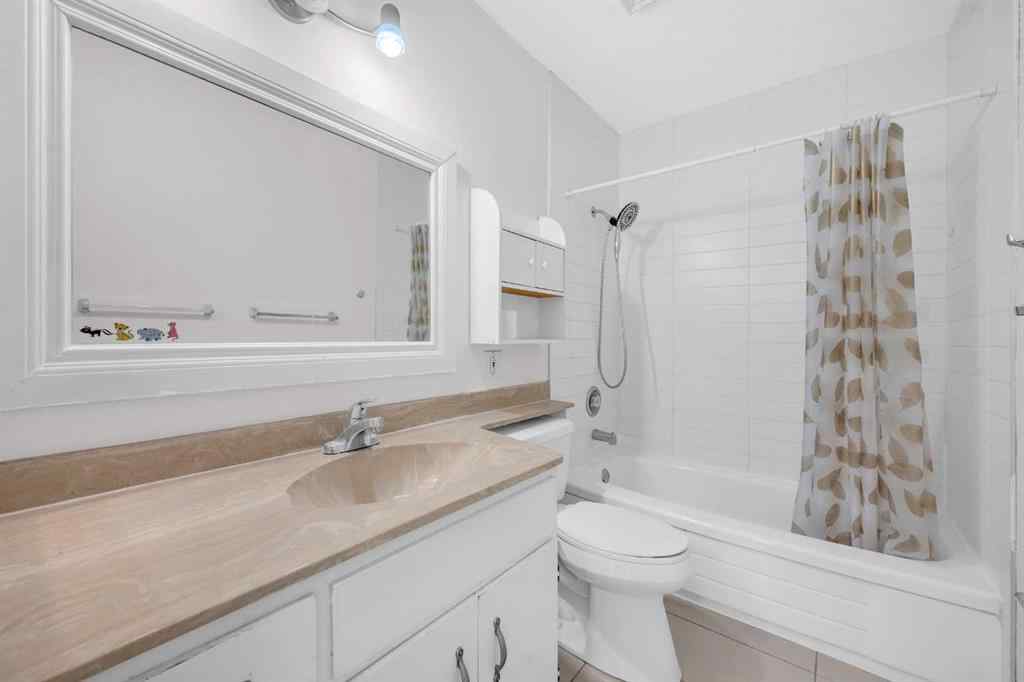 MLS® A2260226 - 325 Woodvale Crescent SW in Woodlands Calgary, Residential