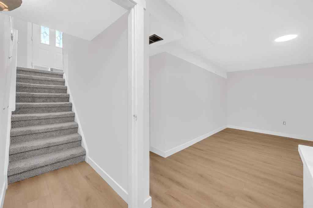 MLS® A2260226 - 325 Woodvale Crescent SW in Woodlands Calgary, Residential