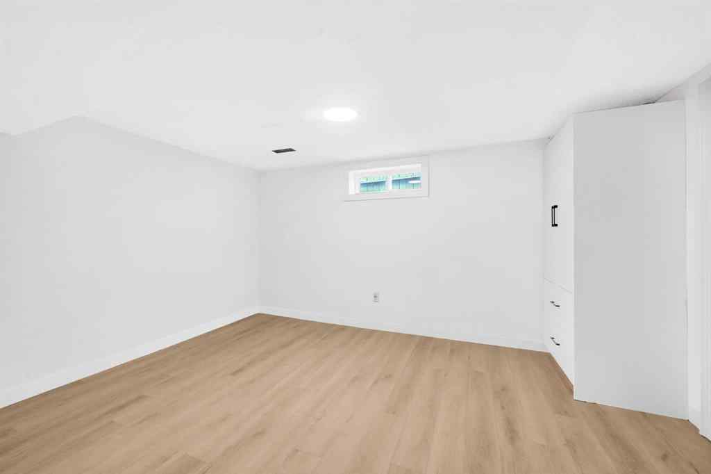 MLS® A2260226 - 325 Woodvale Crescent SW in Woodlands Calgary, Residential