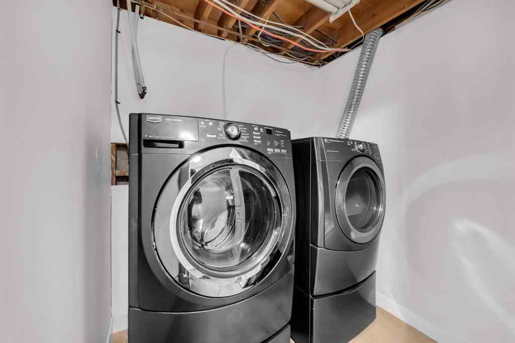 MLS® A2260226 - 325 Woodvale Crescent SW in Woodlands Calgary, Residential