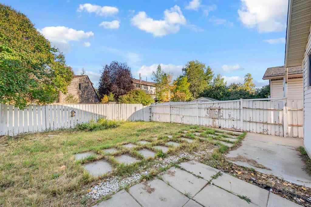 MLS® A2260226 - 325 Woodvale Crescent SW in Woodlands Calgary, Residential