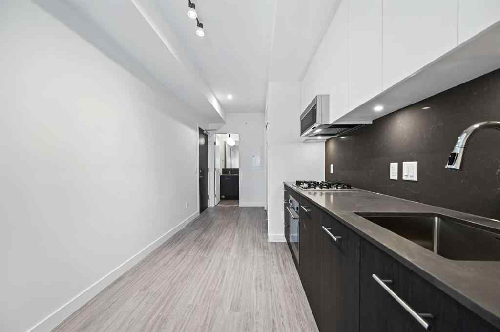 MLS® A2260365 - Unit #704 730 2 Avenue SW in Eau Claire Calgary, Residential