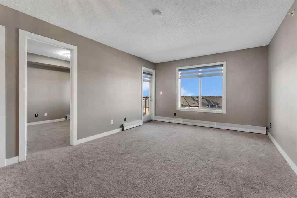 MLS® A2260422 - Unit #415 5 Saddlestone Way NE in Saddle Ridge Calgary, Residential