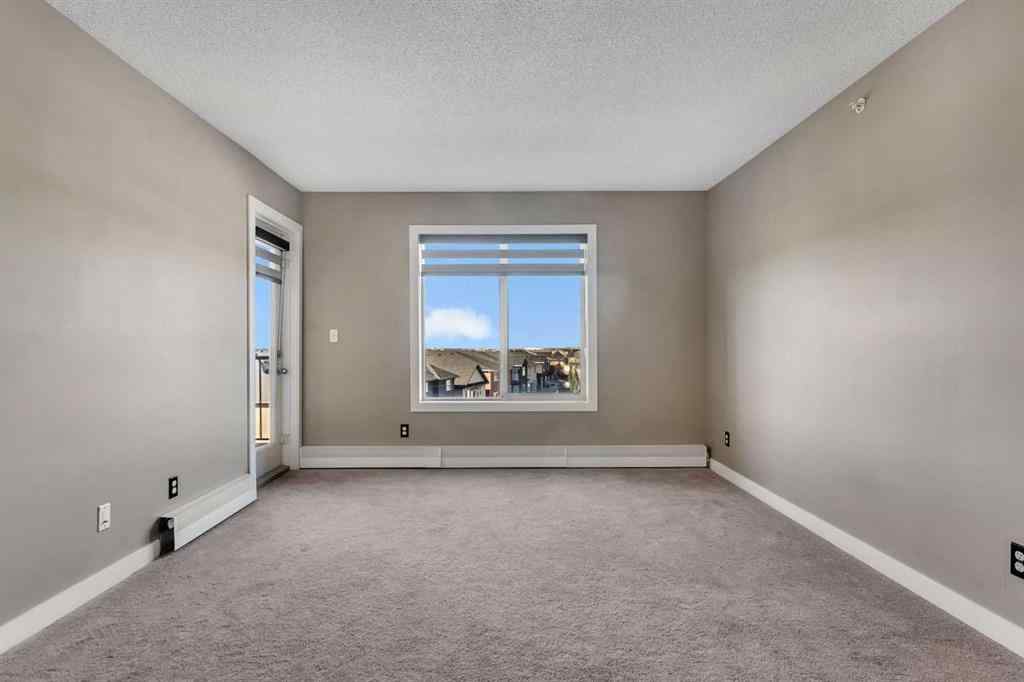MLS® A2260422 - Unit #415 5 Saddlestone Way NE in Saddle Ridge Calgary, Residential