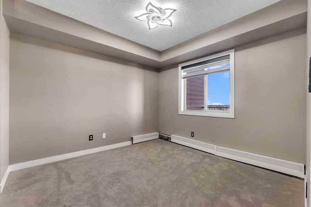 MLS® A2260422 - Unit #415 5 Saddlestone Way NE in Saddle Ridge Calgary, Residential