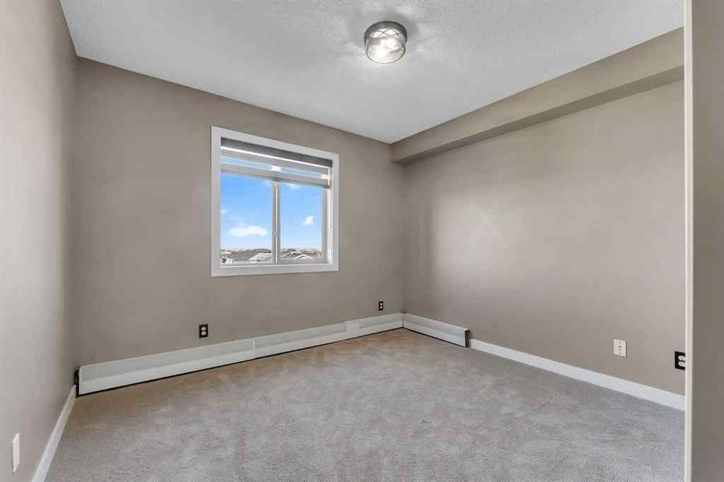 MLS® A2260422 - Unit #415 5 Saddlestone Way NE in Saddle Ridge Calgary, Residential