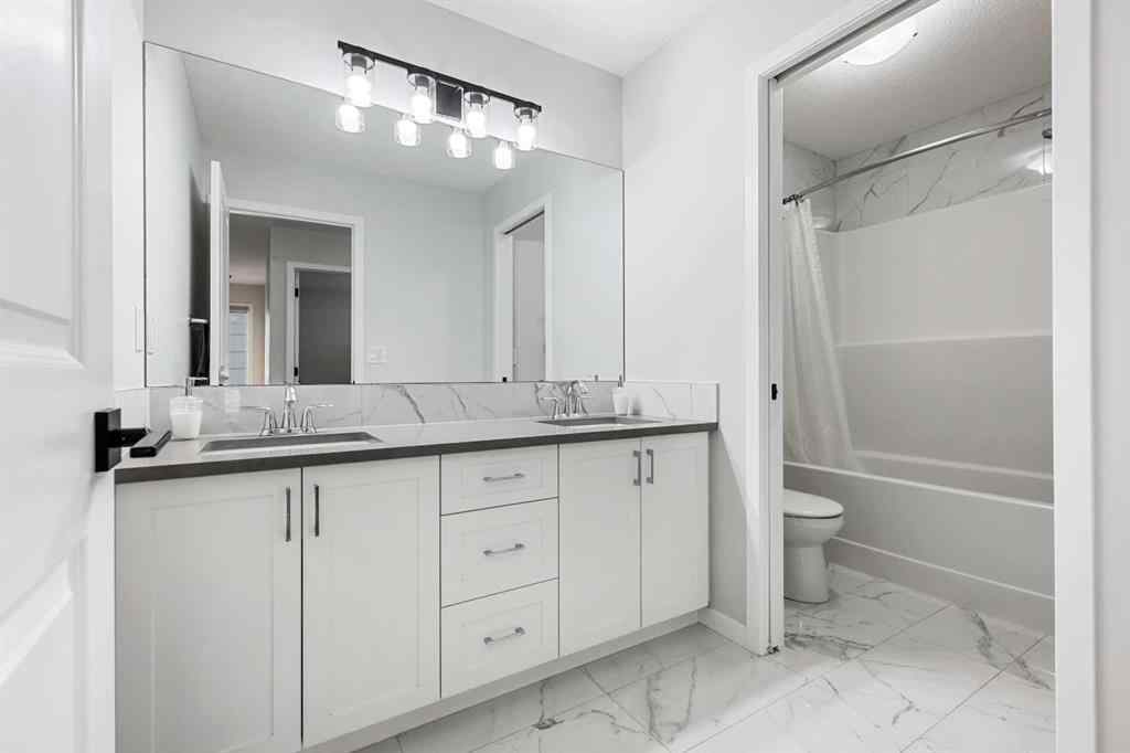 MLS® A2260750 - 186 West Grove Point SW in West Springs Calgary, Residential