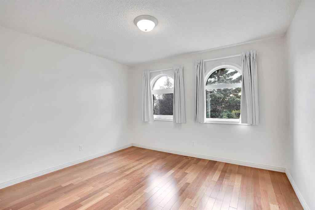 MLS® A2260846 - 38 Strathridge Crescent SW in Strathcona Park Calgary, Residential