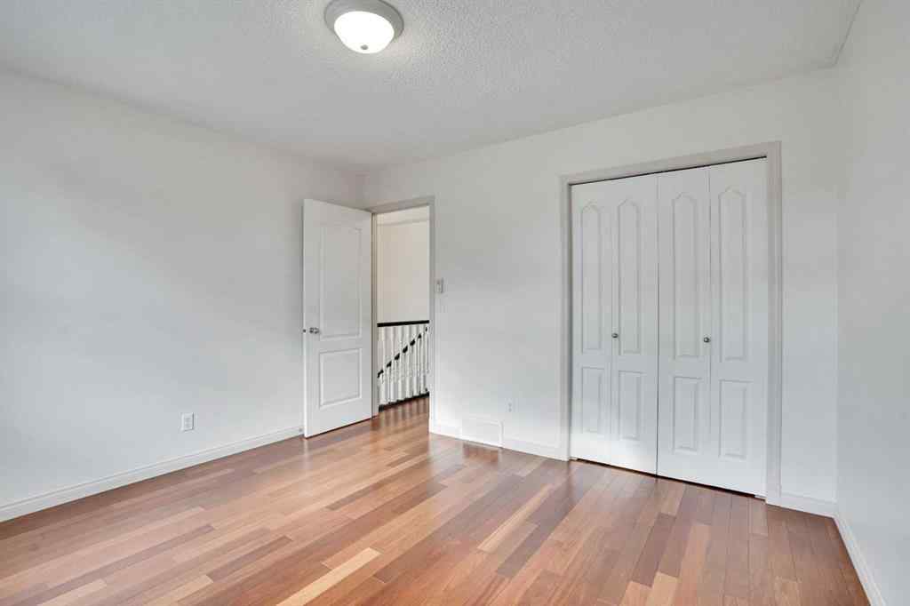 MLS® A2260846 - 38 Strathridge Crescent SW in Strathcona Park Calgary, Residential