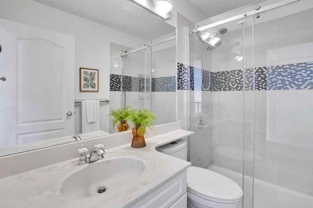 MLS® A2260846 - 38 Strathridge Crescent SW in Strathcona Park Calgary, Residential