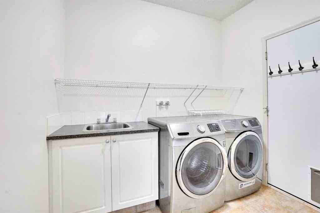 MLS® A2260846 - 38 Strathridge Crescent SW in Strathcona Park Calgary, Residential