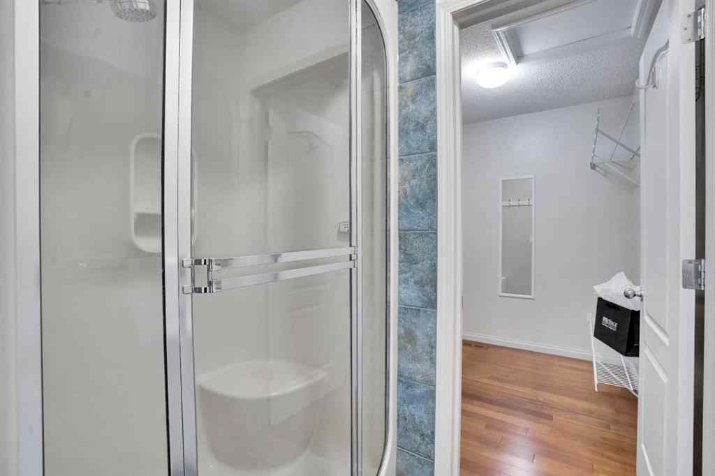 MLS® A2260846 - 38 Strathridge Crescent SW in Strathcona Park Calgary, Residential