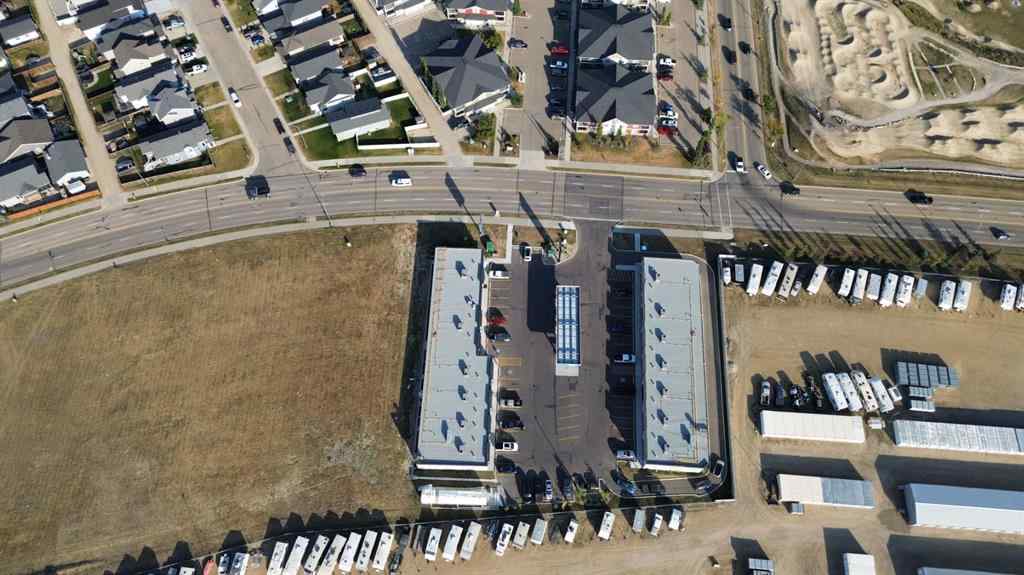 MLS® A2260894 - Unit #215 5302 Vista Trail  in Valley Ridge Blackfalds, Commercial