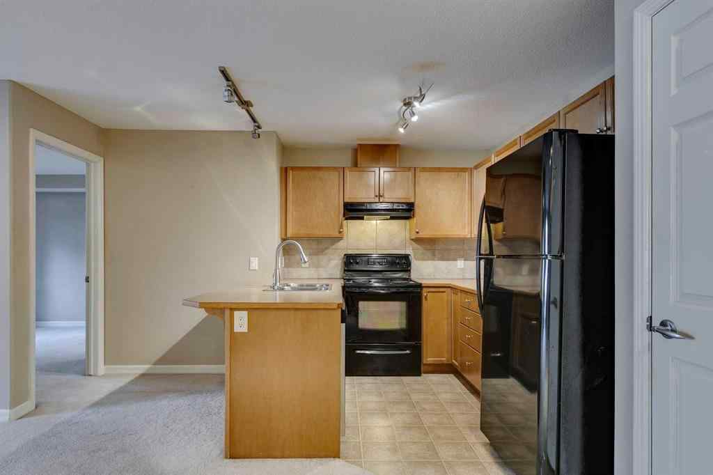 MLS® A2261003 - Unit #2114 92 Crystal Shores Road  in Crystal Shores Okotoks, Residential