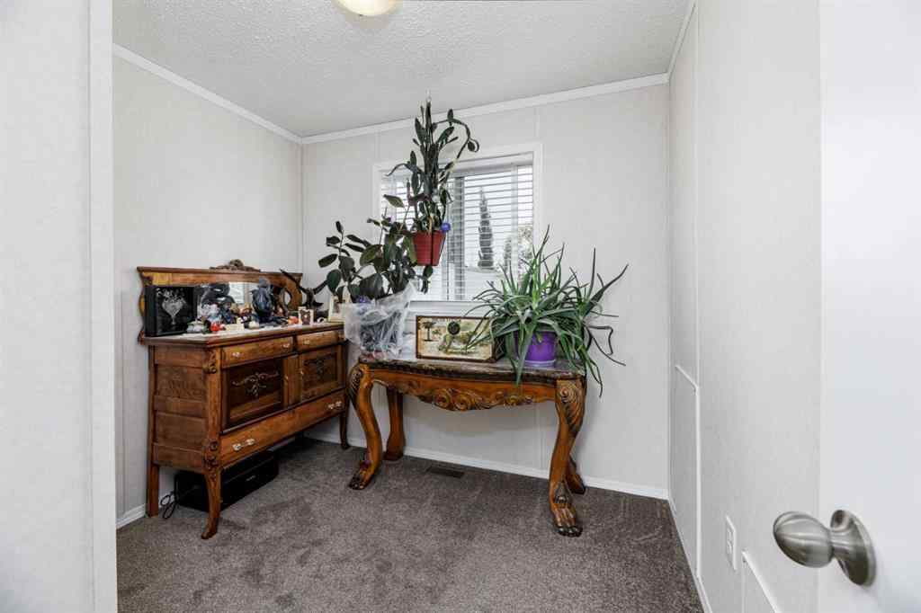 MLS® A2261091 - Unit #65 4922 Womacks   in Broadway Village Mobile Home Park Blackfalds, Mobile