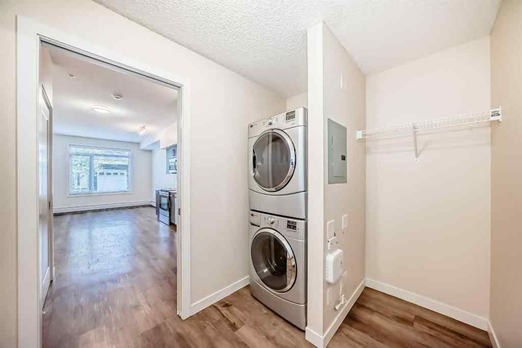 MLS® A2261702 - Unit #108 7 Westpark Common SW in West Springs Calgary, Residential