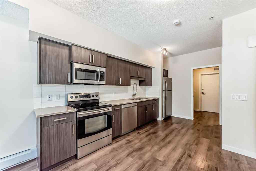 MLS® A2261702 - Unit #108 7 Westpark Common SW in West Springs Calgary, Residential