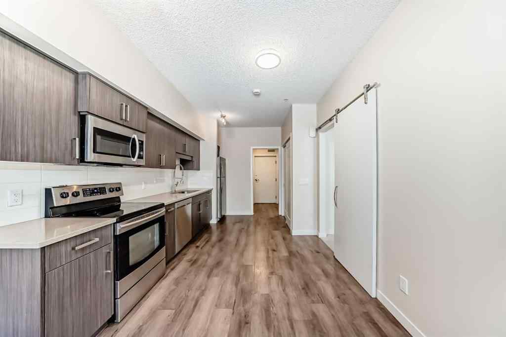 MLS® A2261702 - Unit #108 7 Westpark Common SW in West Springs Calgary, Residential