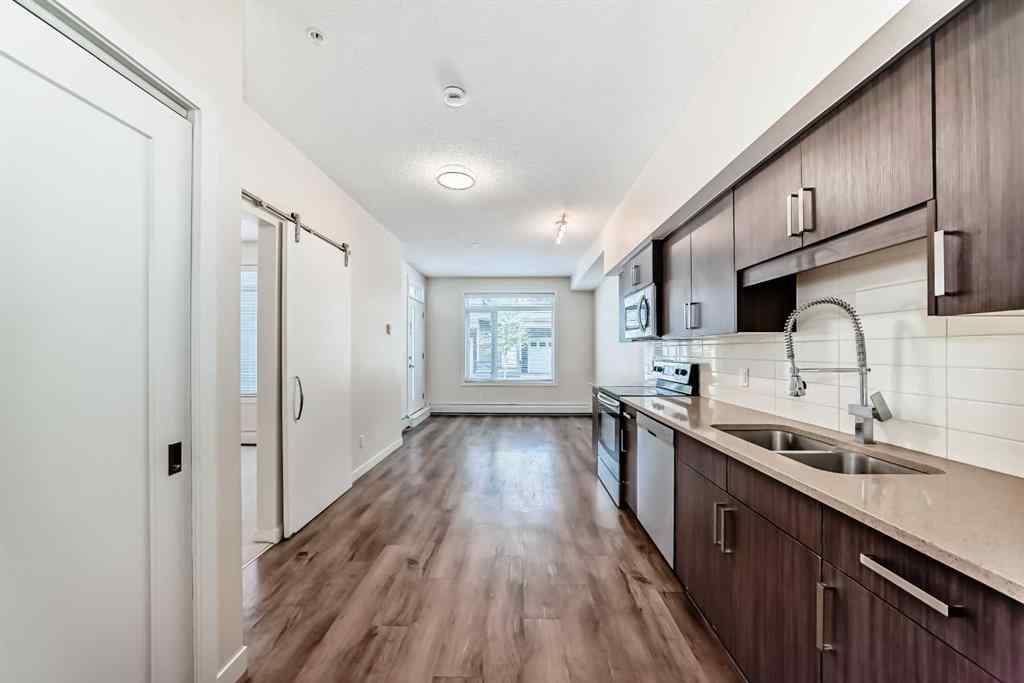 MLS® A2261702 - Unit #108 7 Westpark Common SW in West Springs Calgary, Residential