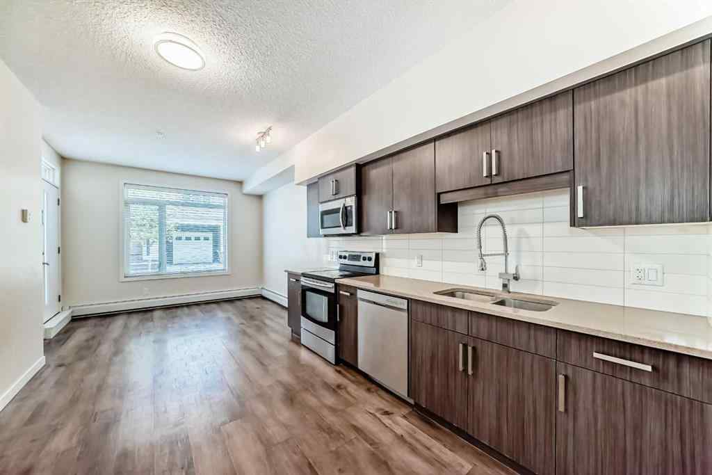 MLS® A2261702 - Unit #108 7 Westpark Common SW in West Springs Calgary, Residential