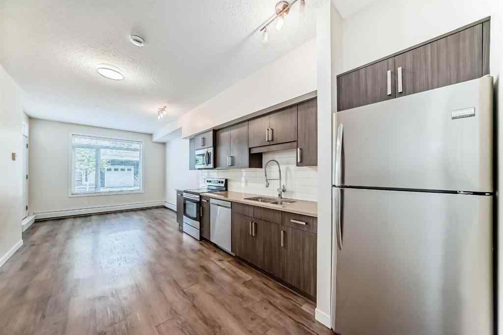 MLS® A2261702 - Unit #108 7 Westpark Common SW in West Springs Calgary, Residential