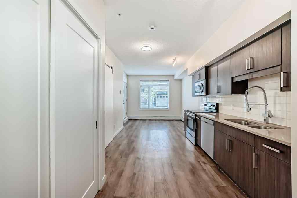 MLS® A2261702 - Unit #108 7 Westpark Common SW in West Springs Calgary, Residential