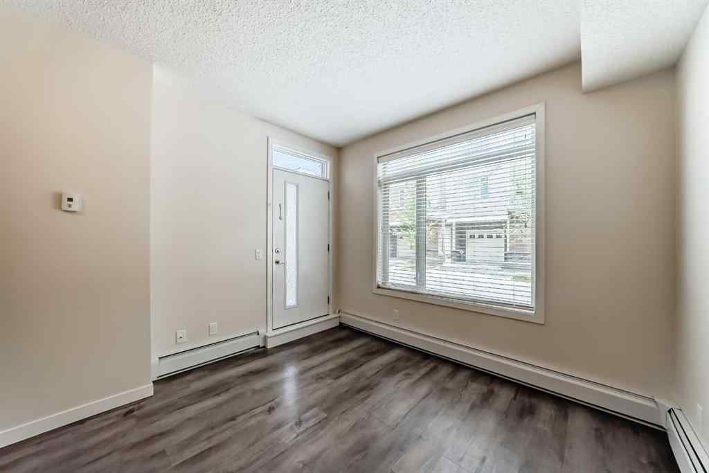 MLS® A2261702 - Unit #108 7 Westpark Common SW in West Springs Calgary, Residential