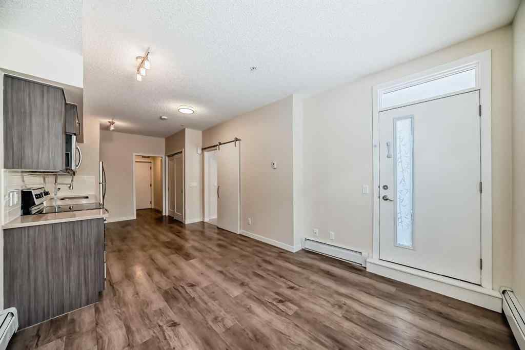 MLS® A2261702 - Unit #108 7 Westpark Common SW in West Springs Calgary, Residential
