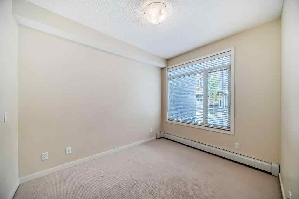 MLS® A2261702 - Unit #108 7 Westpark Common SW in West Springs Calgary, Residential