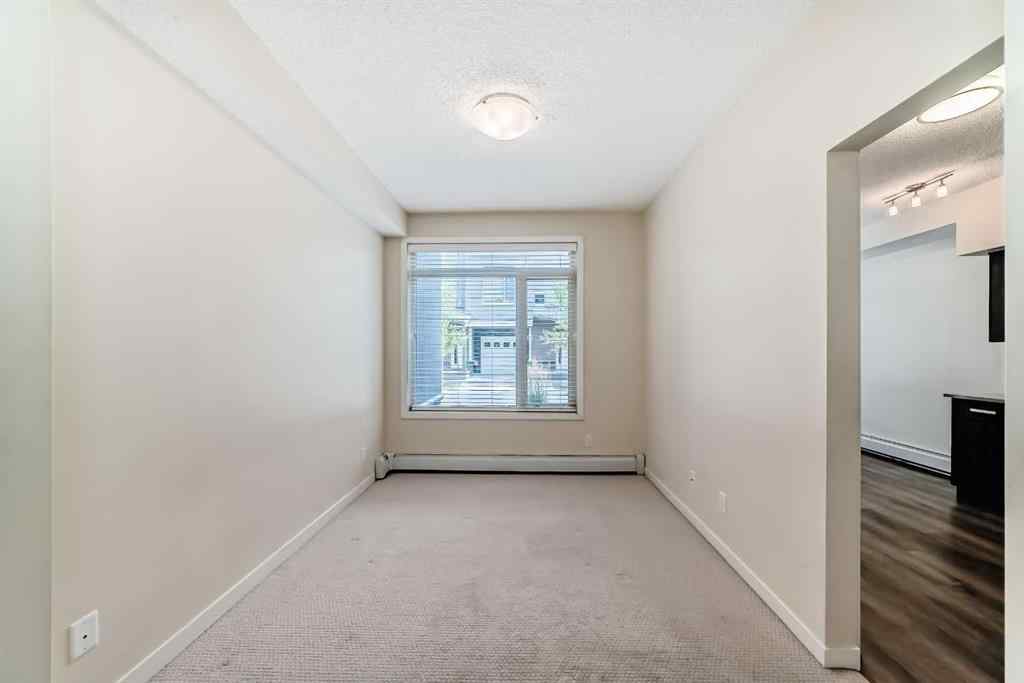 MLS® A2261702 - Unit #108 7 Westpark Common SW in West Springs Calgary, Residential