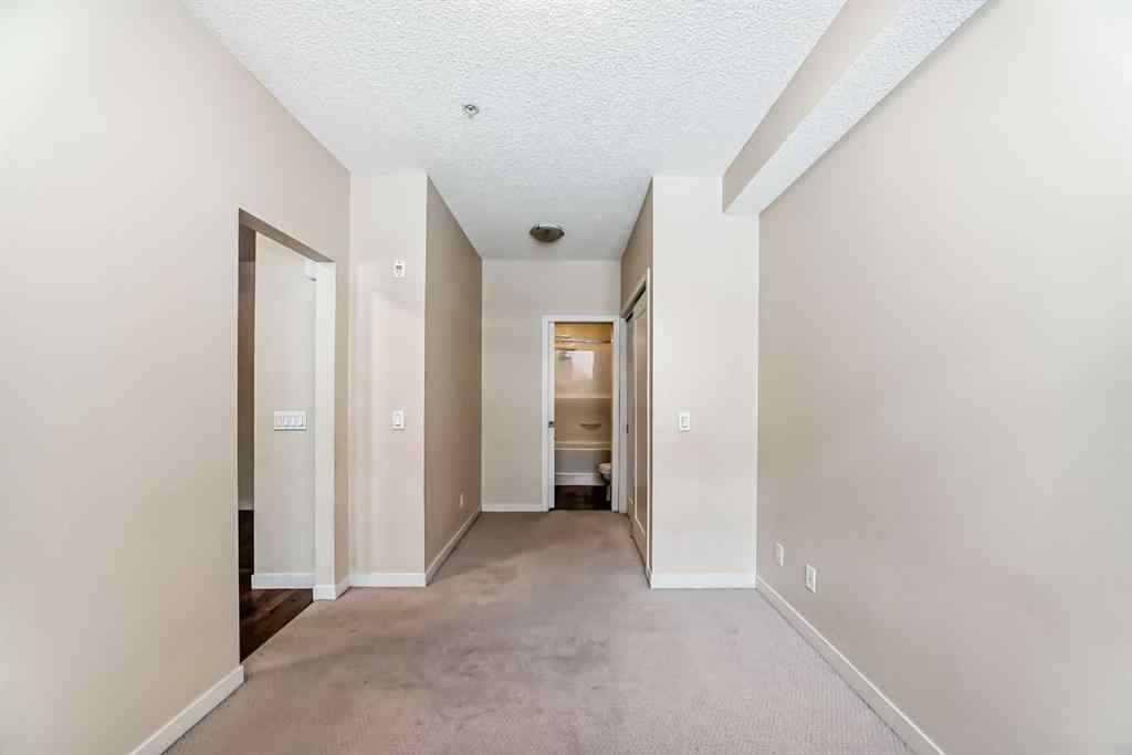 MLS® A2261702 - Unit #108 7 Westpark Common SW in West Springs Calgary, Residential