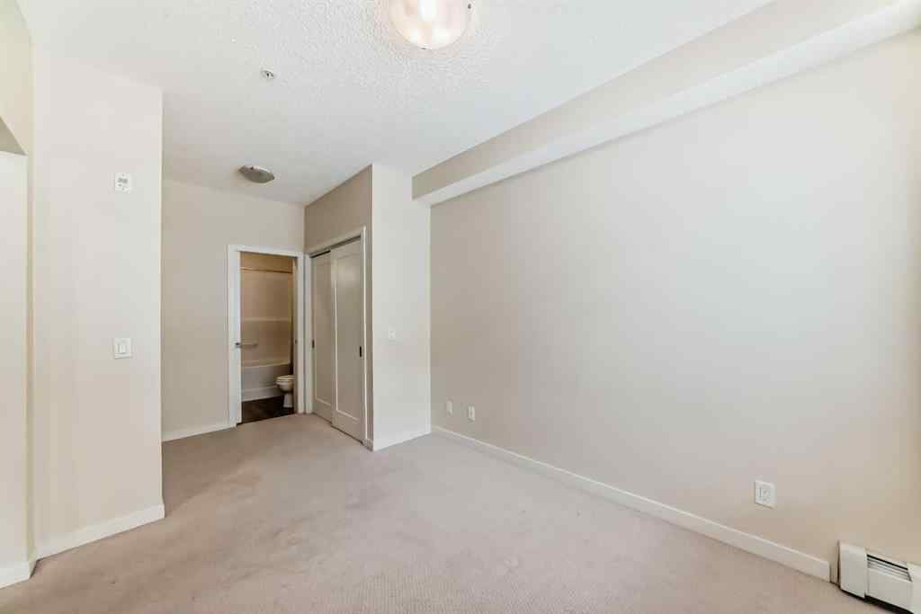 MLS® A2261702 - Unit #108 7 Westpark Common SW in West Springs Calgary, Residential