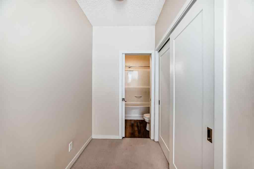 MLS® A2261702 - Unit #108 7 Westpark Common SW in West Springs Calgary, Residential