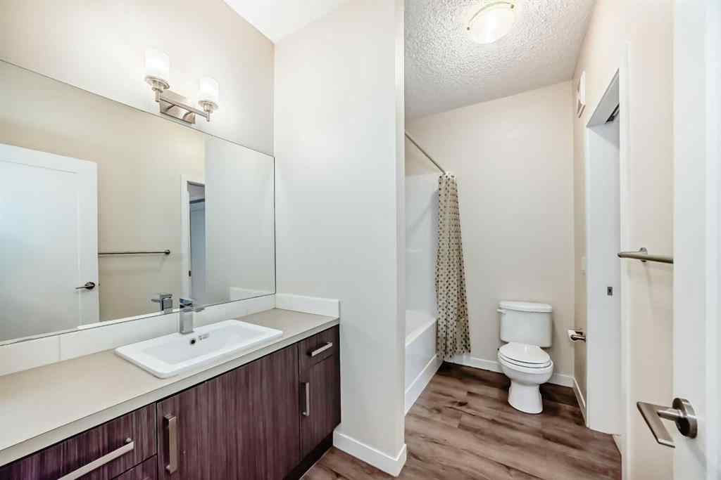 MLS® A2261702 - Unit #108 7 Westpark Common SW in West Springs Calgary, Residential