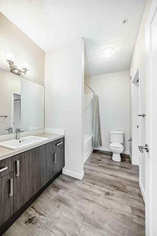 MLS® A2261702 - Unit #108 7 Westpark Common SW in West Springs Calgary, Residential