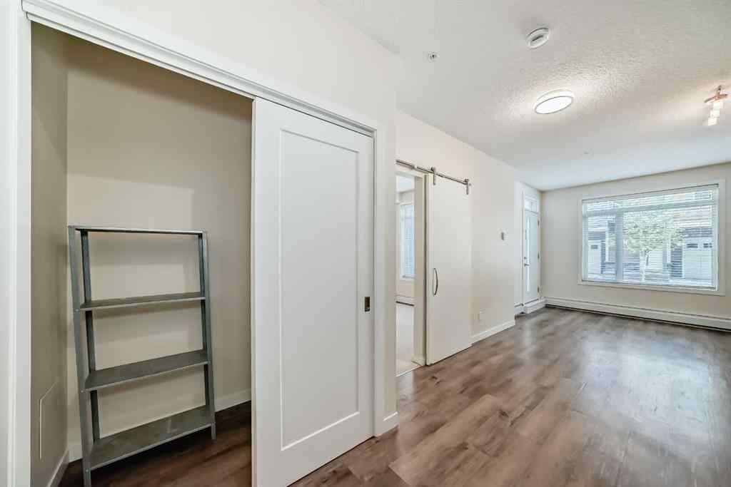 MLS® A2261702 - Unit #108 7 Westpark Common SW in West Springs Calgary, Residential
