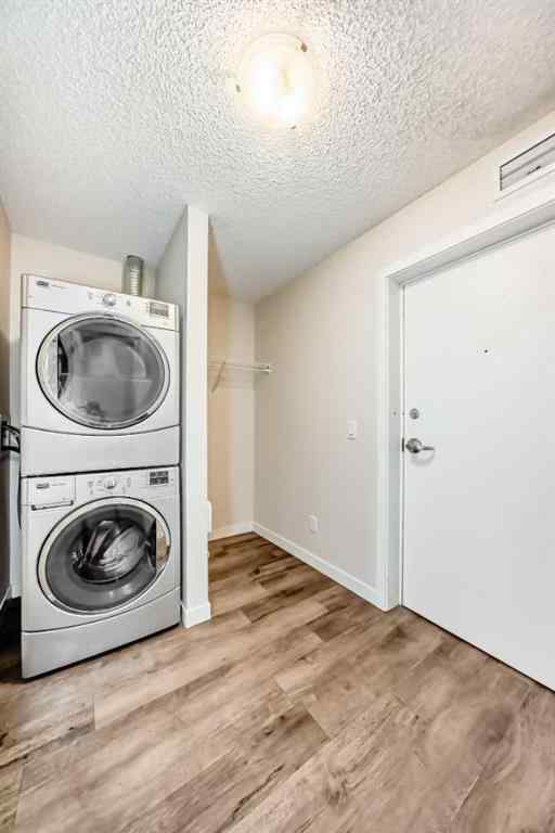 MLS® A2261702 - Unit #108 7 Westpark Common SW in West Springs Calgary, Residential