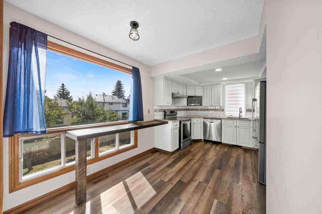 MLS® A2261749 - 36 Strathlorne Crescent SW in Strathcona Park Calgary, Residential