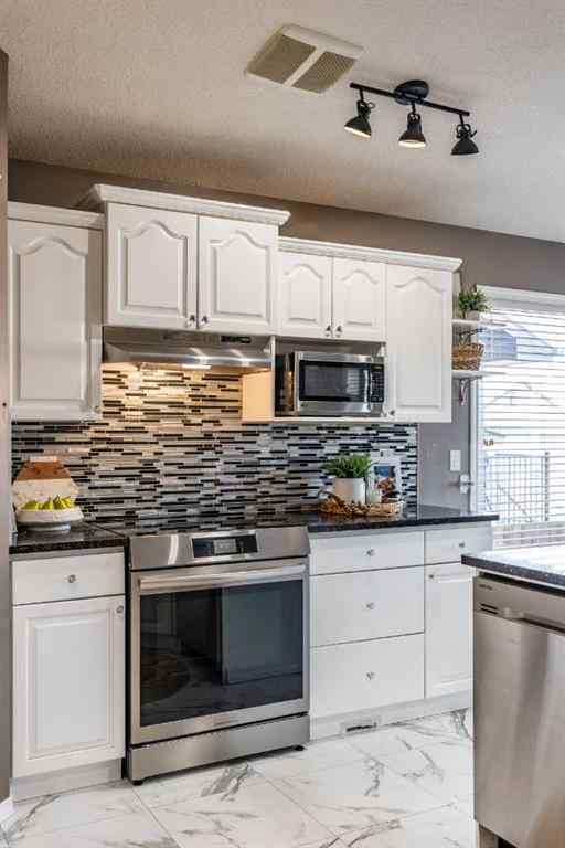 MLS® A2262065 - 310 Jesmond Drive SW in NONE Redcliff, Residential