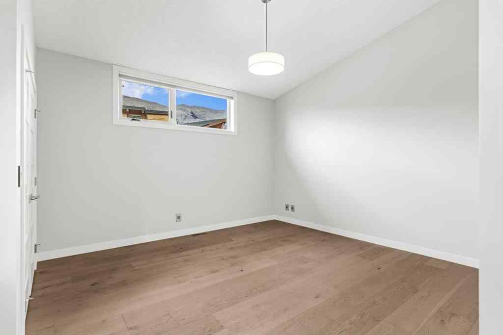 MLS® A2262139 - Unit #204 105 Stewart Creek Rise SW in Three Sisters Canmore, Residential