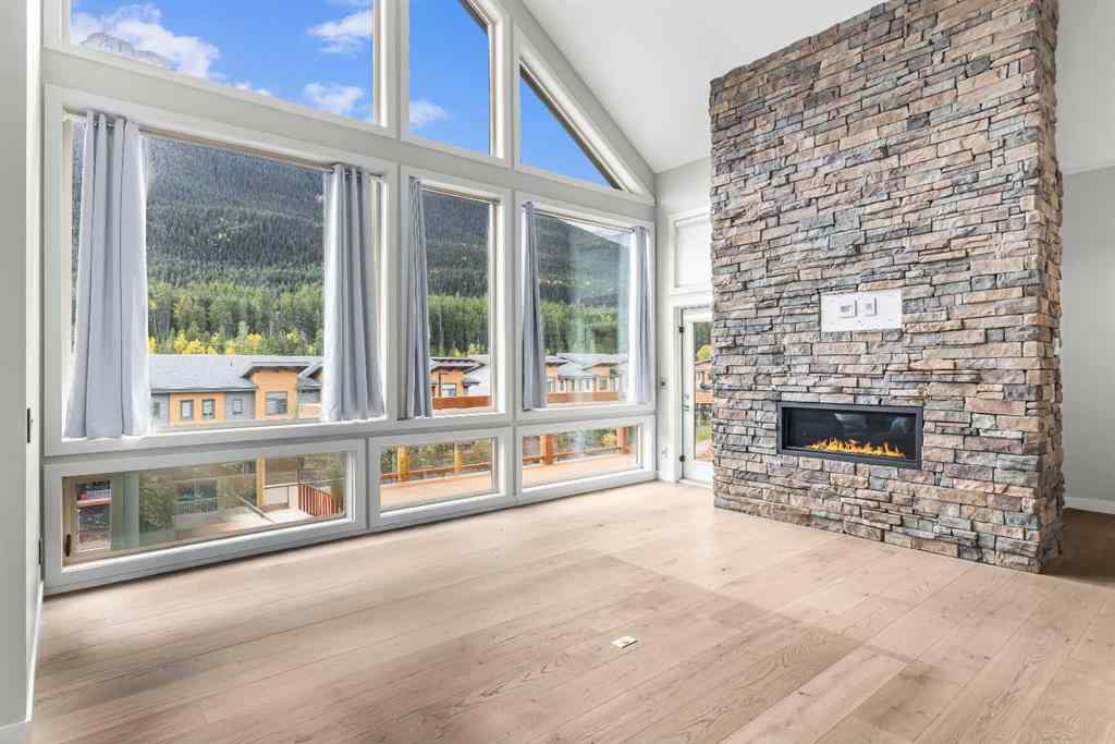 MLS® A2262139 - Unit #204 105 Stewart Creek Rise SW in Three Sisters Canmore, Residential
