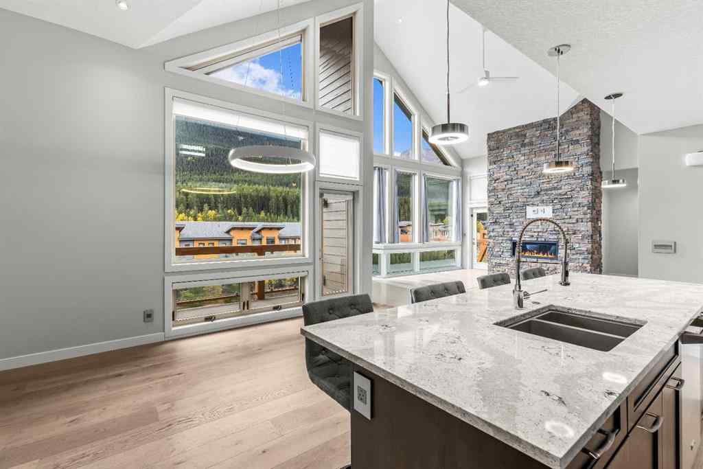 MLS® A2262139 - Unit #204 105 Stewart Creek Rise SW in Three Sisters Canmore, Residential