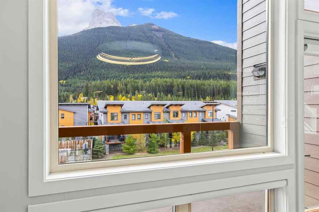 MLS® A2262139 - Unit #204 105 Stewart Creek Rise SW in Three Sisters Canmore, Residential