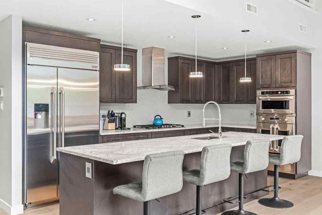 MLS® A2262139 - Unit #204 105 Stewart Creek Rise SW in Three Sisters Canmore, Residential