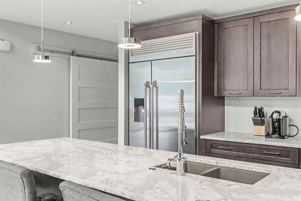 MLS® A2262139 - Unit #204 105 Stewart Creek Rise SW in Three Sisters Canmore, Residential