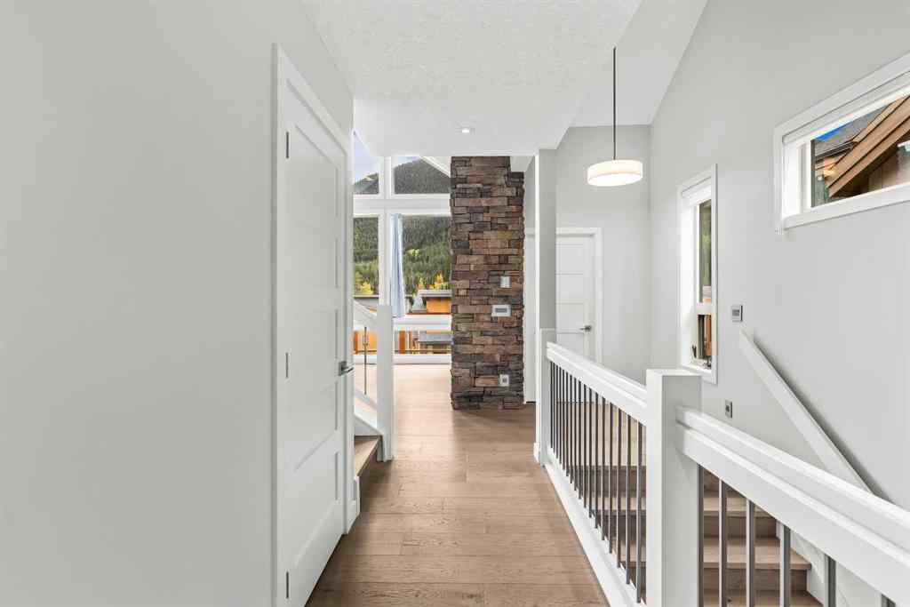 MLS® A2262139 - Unit #204 105 Stewart Creek Rise SW in Three Sisters Canmore, Residential