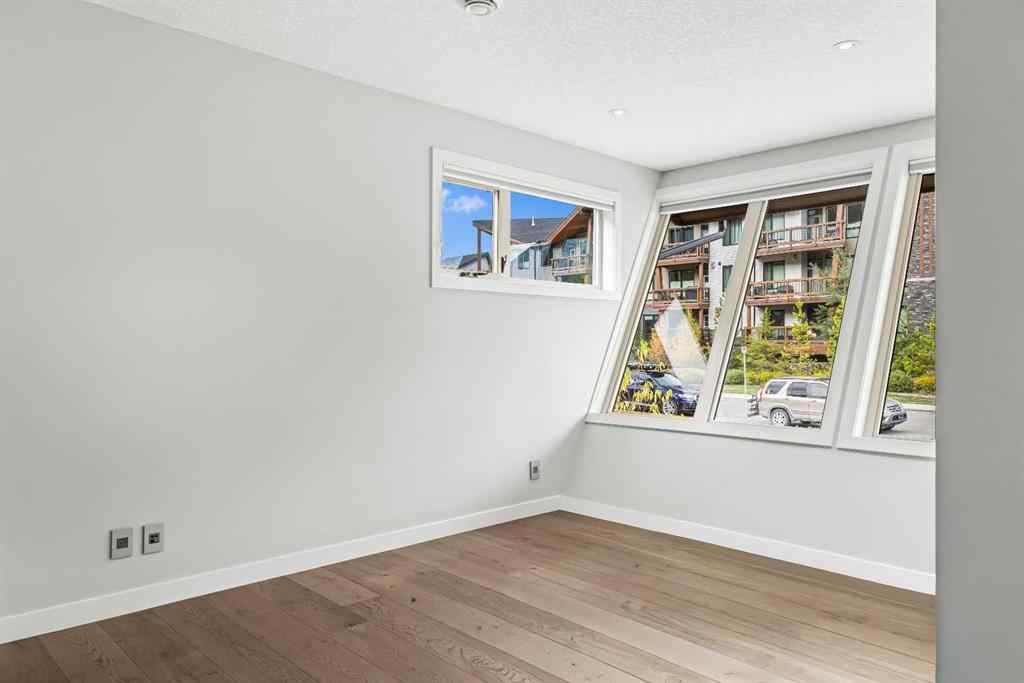 MLS® A2262139 - Unit #204 105 Stewart Creek Rise SW in Three Sisters Canmore, Residential