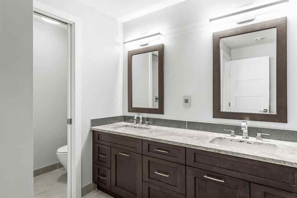 MLS® A2262139 - Unit #204 105 Stewart Creek Rise SW in Three Sisters Canmore, Residential